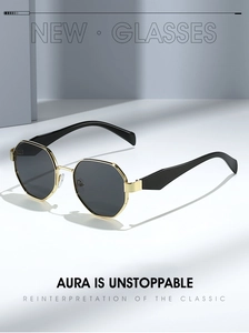 Macro detail of octagonal gold metal frame sunglasses with dark gray polarized lenses