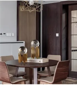 Detail of luxury crystal balls on gold geometric metal bases for home decor