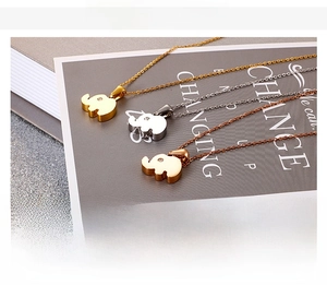 Detailed view of elephant pendant necklaces in gold, silver, and rose gold stainless steel