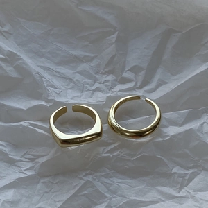 Detailed macro view of gold plated S925 sterling silver rings with hallmark engraving