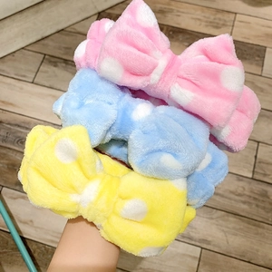Soft plush bow wash headband with polka dots in pink blue and yellow colors