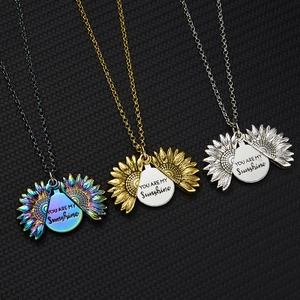 Three opening sunflower necklaces in rainbow, gold, and silver finishes with engraving