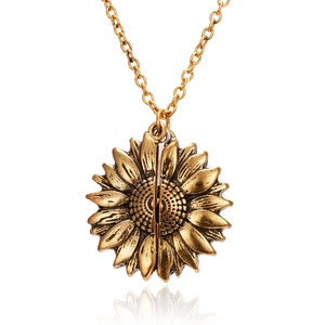 Creative gold sunflower locket necklace with vintage texture on white background