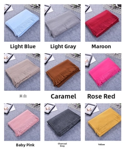 Detail grid of thick cashmere-like winter scarves showing diverse colors and fringe edges