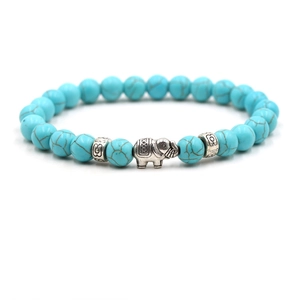 Turquoise beaded stretch bracelet for men featuring a vintage silver elephant pendant charm