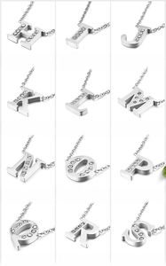 Macro display of crystal-encrusted letter pendants from H to S in titanium steel