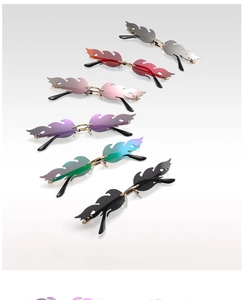 Detailed display of colorful flame-shaped rimless sunglasses with metal temples and sleek design