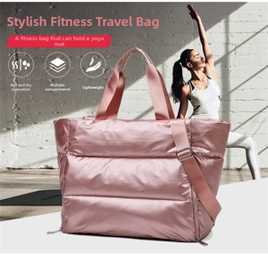 Pink quilted fitness bag with waterproof wet-dry pocket and yoga mat storage