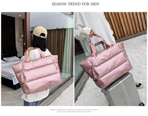 Pink quilted travel bag featuring a luggage handle sleeve for gym and weekend trips