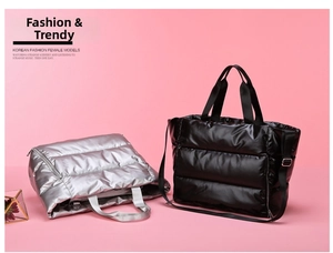 Detailed view of quilted puffer tote bags in black and silver with detachable straps