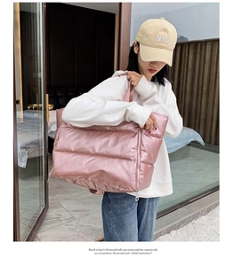 Fashionable pink padded gym bag for women featuring waterproof glossy nylon fabric