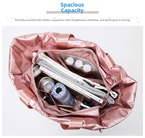 Internal view of pink gym bag showing high capacity storage for towels and accessories