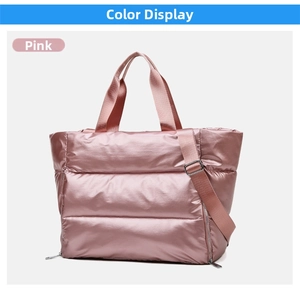Detail of pink quilted gym bag with metallic finish and adjustable shoulder strap