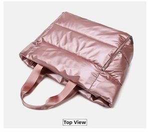 Top view of metallic pink quilted gym bag with glossy finish and nylon handles