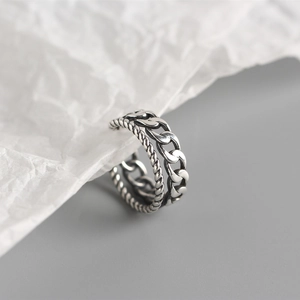 Close-up of S925 sterling silver double-layer twist and Cuban chain ring with vintage finish
