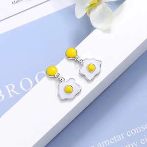 Poached egg design stud earrings with white and yellow enamel on a silver base