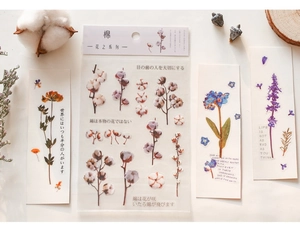 Detail of floral PET stickers with cotton plants and purple flowers for DIY journaling