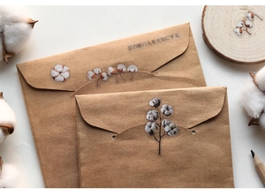 Vintage kraft paper envelope with cotton floral sticker and Japanese text detail