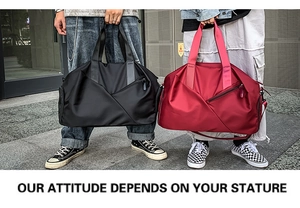 Outdoor street shot of large nylon travel bags in black and red held by models