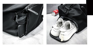 Detail view of the waterproof travel bag featuring a separate shoe compartment and side pocket