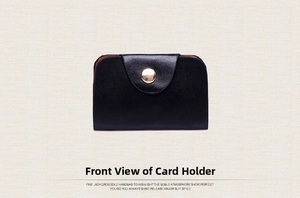 Front view of a minimalist black leather card wallet with a gold metal button closure