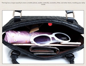 Top view of spacious black quilted tote showing internal pockets with daily essentials inside