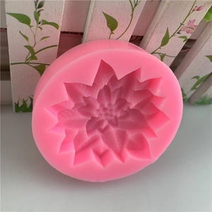 Pink silicone mold with holly leaf and berry patterns for Christmas cake decoration