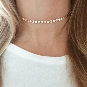 Detail of 14K gold plated stainless steel disc necklace with 35cm chain on model