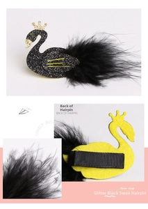 Detailed views of a black swan hair clip featuring glitter finish and soft feathers