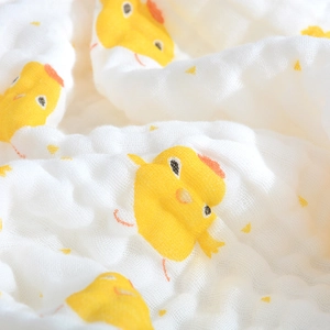 Soft six-layer cotton gauze baby blanket with cute yellow chick patterns and bubble texture
