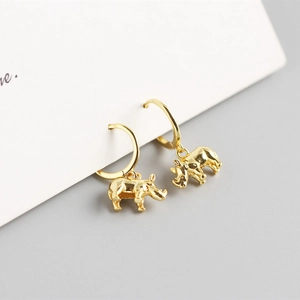 Detail of 925 sterling silver rhino charms on gold hoops with polished finish