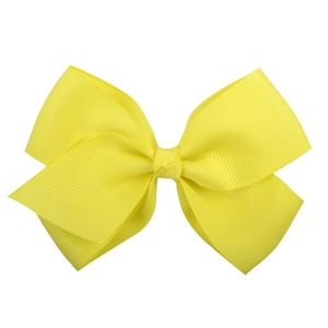 Detail view of yellow ribbed ribbon hair bow with classic double-layer stacked design