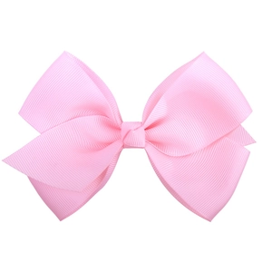 Detail of bright pink grosgrain ribbon bow hair clip with textured ribbed fabric texture