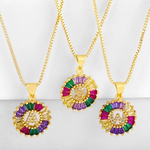 Gold letter necklace with circular pendants featuring A, S, W with colorful zircons