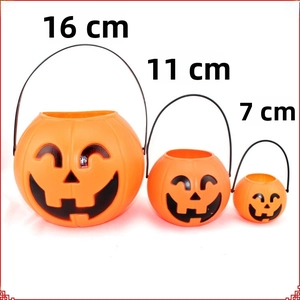 Three sizes of orange Halloween pumpkin buckets with black handles for candy treats