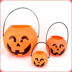 Three sizes of orange plastic Halloween pumpkin buckets with black handles for candy