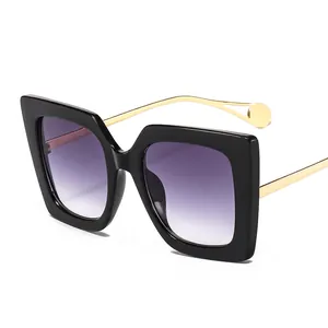Fashionable oversized square sunglasses with black frame and purple gradient lenses