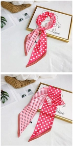 Detail of pink silk scarf with white polka dots showing knotted and flat styling views
