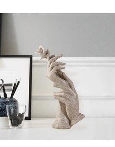 Close-up of artistic resin hand-holding-rose sculpture with fine matte stone texture