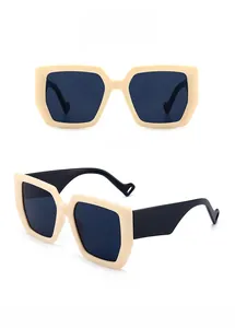 Detail of chunky cream square sunglasses with wide temples and grey lenses