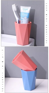 Stackable geometric wheat straw rinsing cups in soft pastel pink and blue colors