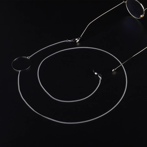 Silver stainless steel eyeglass chain with round clasp and rubber loops on black background