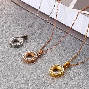 Three round crystal pendant necklaces in silver, gold, and rose gold titanium steel finish