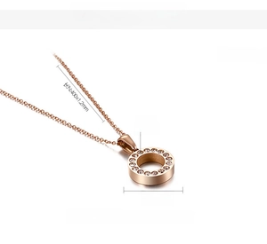 Detail of rose gold titanium steel necklace with 15mm circular zircon paved pendant