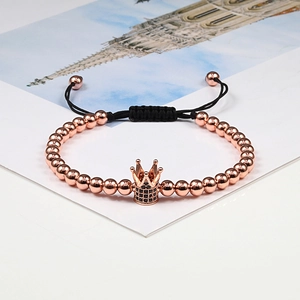 Rose gold crown bracelet with micro-paved black zircon beads on a black braided cord