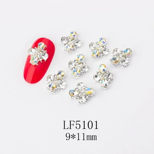 Macro shot of 9x11mm flower nail art charms with aurora rhinestones and metal alloy base