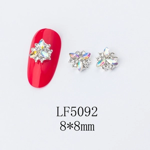 Macro detail of LF5092 8mm 3D flower nail charms with AB aurora rhinestones