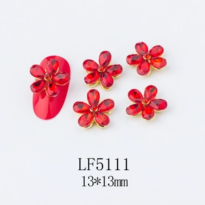 Macro detail of red 5-petal flower nail charms with 13x13mm alloy base for nail art