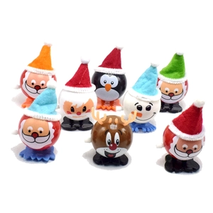 Group of Christmas wind-up toys featuring Santa Claus, snowman, penguin, and reindeer