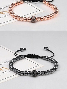 Detail of adjustable woven bracelet with zircon paved beads in rose gold and gunmetal finish